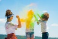 Kids playing with colours, children celebrating holi festival of colours. Children on Holi paint party. Royalty Free Stock Photo