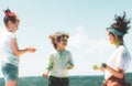 Kids playing colours. Holi festival of colors. Kids with face smeared with colors. Child girls and boy celebrate Indian Royalty Free Stock Photo