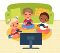 Kids playing console. Happy children sitting on floor with joysticks front TV screen. Gamers with controllers. Boys and Royalty Free Stock Photo