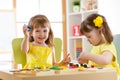 Kids playing with developmental toys at home or kindergarten or playschool Royalty Free Stock Photo