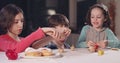 Kids playing with dreidels during Hanukka at home