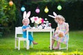 Kids playing Easter tea party with toys Royalty Free Stock Photo