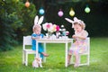 Kids playing Easter tea party with toys Royalty Free Stock Photo