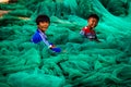 Kids playing in fishing nets