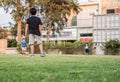 Kids playing footbal on green grass, in a home garden