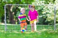 Kids playing football in school yard Royalty Free Stock Photo