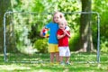 Kids playing football in school yard Royalty Free Stock Photo