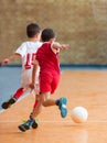 Kids playing football soccer game on sports field Royalty Free Stock Photo