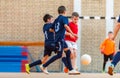 Kids playing football soccer game on sports field Royalty Free Stock Photo