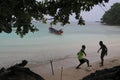 Kids playing football at Winnifred beach