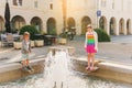 Kids playing by the fountain on summer day Royalty Free Stock Photo