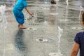 Kids playing in fountainn