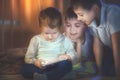 Kids playing games on tablet pc. Three little boys with tablet computer Royalty Free Stock Photo