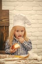 Kids playing - happy game. Boy cook in chef hat in kitchen Royalty Free Stock Photo