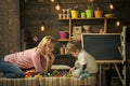 Kids playing - happy game. Side view cute boy and smiling woman play with plastic blocks. Mom leaning forward to her son