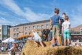Kids playing at hay bales on a Dutch agricultural potato festival Royalty Free Stock Photo