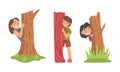 Kids playing hide and seek set. Cute children hiding behind trees in park cartoon vector illustration Royalty Free Stock Photo