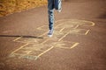 Kids playing hopscotch on playground outdoors. Hopscotch popular street game Royalty Free Stock Photo