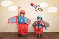 Kids playing with jet pack at home Royalty Free Stock Photo