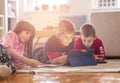 Kids playing with laptop computer at home Royalty Free Stock Photo