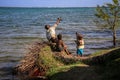 3 kids playing nearby the sea, foulpointe, Atsinanana, Madagascar Royalty Free Stock Photo