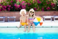 Kids playing at outdoor swimming pool Royalty Free Stock Photo