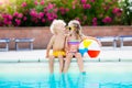 Kids playing at outdoor swimming pool