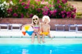 Kids playing at outdoor swimming pool Royalty Free Stock Photo