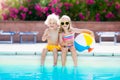 Kids playing at outdoor swimming pool Royalty Free Stock Photo