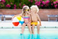 Kids playing at outdoor swimming pool Royalty Free Stock Photo