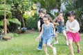 Kids playing outdoors with friends. little children play at nature park. Royalty Free Stock Photo