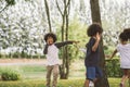 Kids playing outdoors with friends. little children play at nature park. Royalty Free Stock Photo