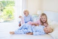 Kids in bed. Children in pajamas. Family bedroom. Royalty Free Stock Photo