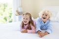 Kids in bed. Children in pajamas. Family bedroom. Royalty Free Stock Photo