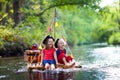 Kids playing pirate adventure on wooden raft Royalty Free Stock Photo