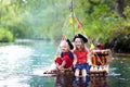 Kids playing pirate adventure on wooden raft Royalty Free Stock Photo