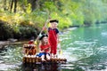 Kids playing pirate adventure on wooden raft Royalty Free Stock Photo