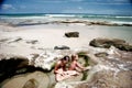 Kids playing at rock pool