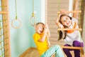 Kids playing on a rope ladder at home