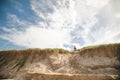 Kids playing on the sand dunes at the beach, Coffs Harbour Australia