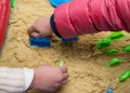 Kids playing sand and plastic mould Royalty Free Stock Photo