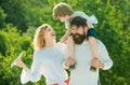 Kids playing with simple paper planes on sunny day. Family Time Together. Portrait of happy father giving son piggyback Royalty Free Stock Photo