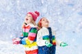 Kids playing in snow. Children play in winter. Royalty Free Stock Photo