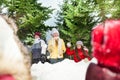 Kids playing snowballs hiding behind snow tower Royalty Free Stock Photo