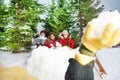Kids playing snowballs at the winter forest Royalty Free Stock Photo