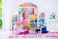 Kids playing with stuffed animals and doll house Royalty Free Stock Photo