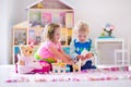 Kids playing with stuffed animals and doll house Royalty Free Stock Photo