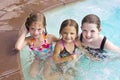 Kids playing in the swimming pool together Royalty Free Stock Photo
