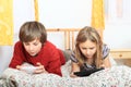 Kids playing with tablet and smartphone Royalty Free Stock Photo