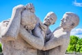 Kids playing with their mother statue in Vigeland Park, Oslo